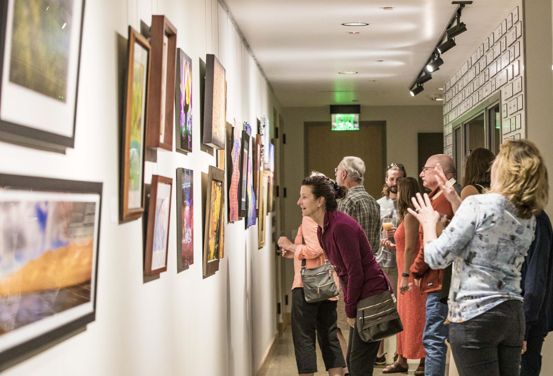 people admiring artwork