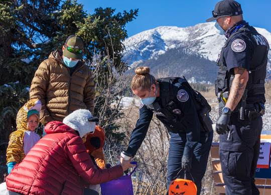 police officers and trick or treaters