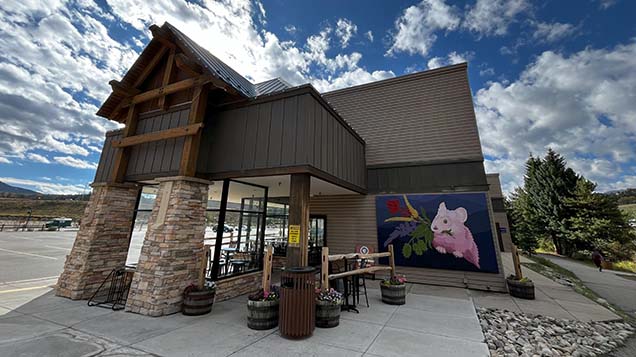 pika mural outside thirsty pika taproom with blue sky and clouds in background